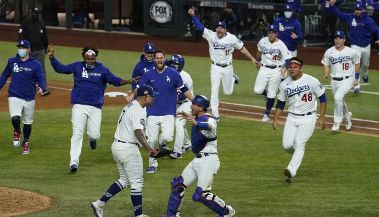 Los Angeles Dodgers celebrate after defeating the Tampa Bay Rays 3-1 to win the baseball World Series in Game 6 Tuesday, Oct. 27, 2020, in Arlington, Texas. (AP Photo/Tony Gutierrez)