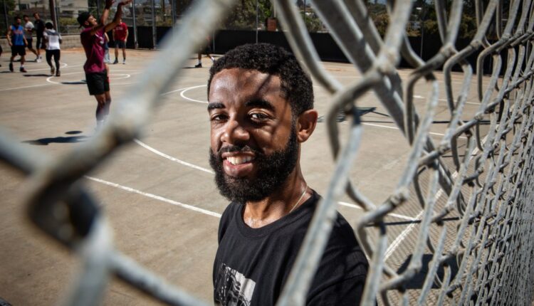 Pickup basketball players share communion on the court

