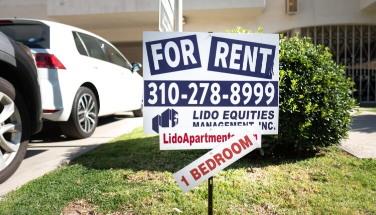A “for rent” sign sits on a lawn outside an apartment building on Cardiff Ave. in Palms, Los Angeles.