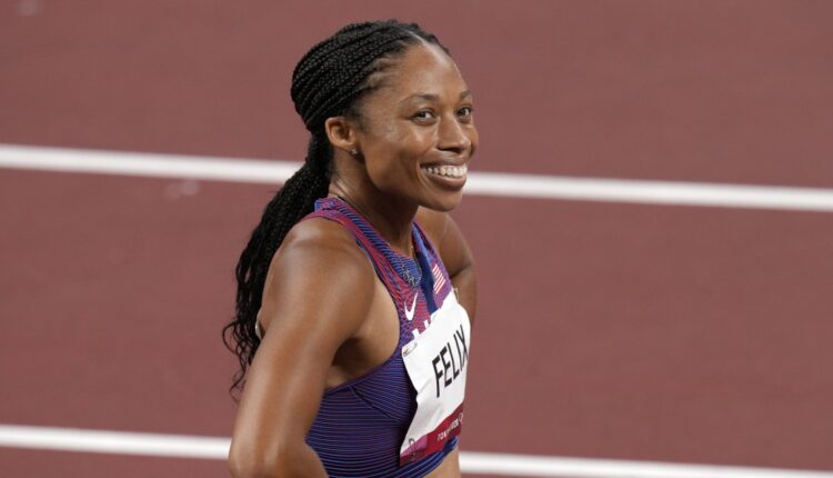 Allyson Felix wins bronze in the women's 400, setting the US record

