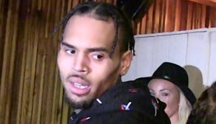 Chris Brown's security files battery report after a man allegedly spat on him

