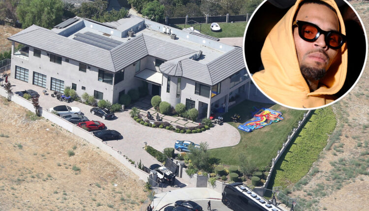 Chris Brown's security files report after a man spat on guard

