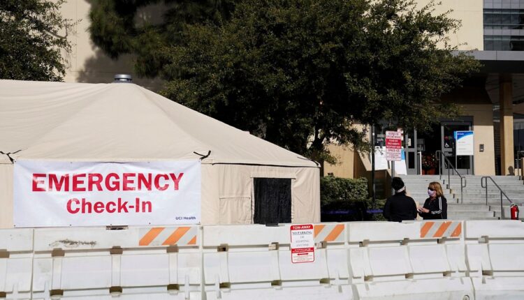 In this Dec. 17, 2020, file photo, medical tents are set up outside the emergency room at UCI Medical Center in Irvine, Calif.  (AP Photo/Ashley Landis)