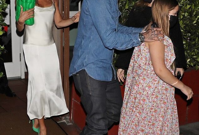 Family time: Victoria Beckham, 47, was smart in a cami and flowing skirt while husband David, 46, wore jeans when they left Giorgio Baldi in Santa Monica with Harper Seven, 10, on Tuesday