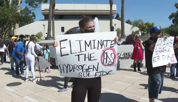 Carson residents rally in front of city hall for a solution to the odor problems emanating from the Dominguez Channel. (Spectrum News1)