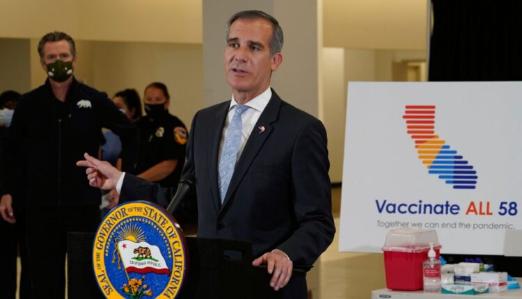 LA Mayor Eric Garcetti addresses questions about the COVID-19 vaccines at the Baldwin Hills Crenshaw Plaza in Los Angeles, April 1, 2021. (AP Photo/Damian Dovarganes