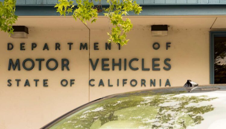 State of California Department of Motor Vehicles sign in the town of Los Gatos, on May 16, 2018. A California man is dying to get his driver's license renewed — he just needs to be declared living again. 