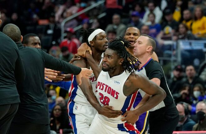 Detroit Pistons Center Isaiah Stewart (28) is held back in Detroit after a foul in the second half of an NBA basketball game against the Los Angeles Lakers on Sunday, November 21, 2021.