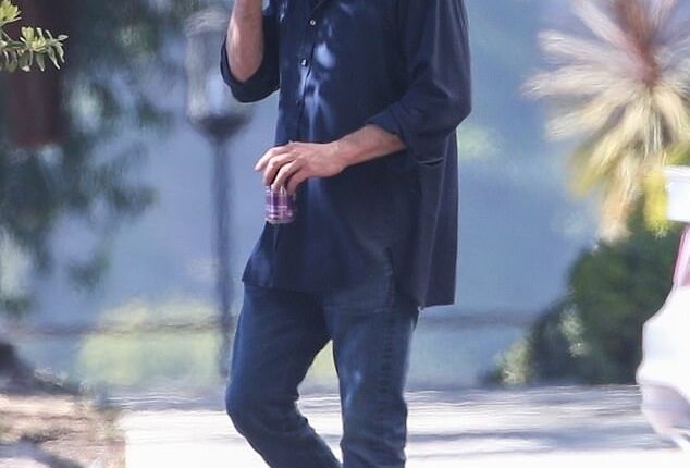 Finished: Ben Affleck finished a cigarette and a canned beverage before picking up his son Samuel from school in Santa Monica.