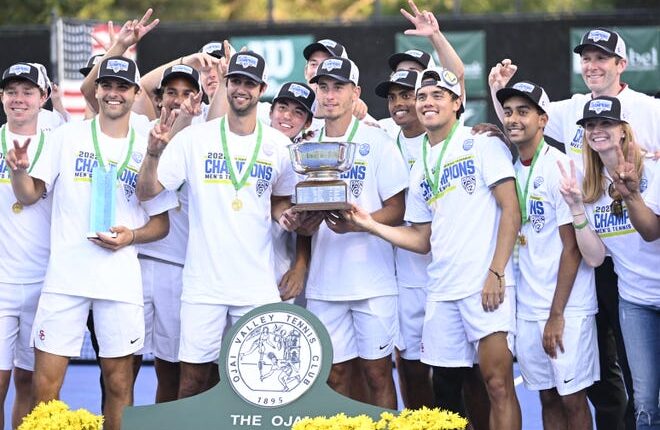 The USC men's tennis team poses with the trophy after winning the Pac-12 title Saturday at The Ojai Tennis Tournament.