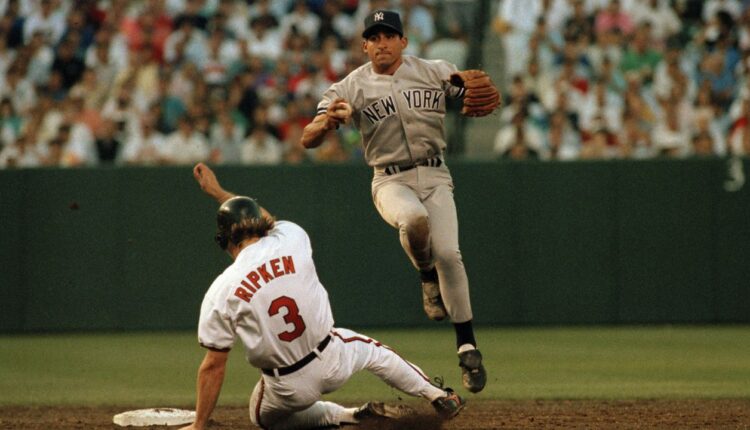 Baltimore Orioles baserunner Bill Ripken (3) is forced out at second by New York Yankees shortstop Andy Stankiewicz but prevents the throw to first during the second inning in Baltimore, June 20, 1992. (AP Photo/Edwin H. Remsberg)