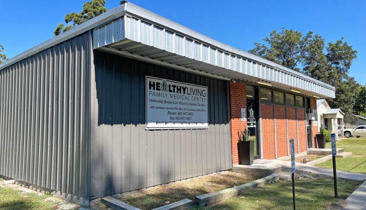 A photo shows the outside of Healthy Living Family Medical Center.