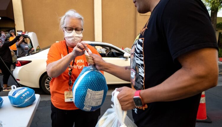 Food giveaway at Dignity Health Northridge Hospital had a surprise, a turkey - Daily News
